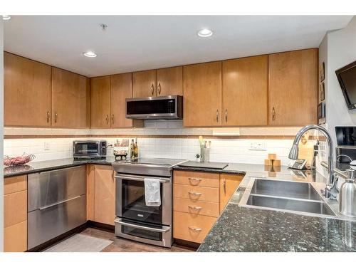 215-1108 6 Avenue Sw, Calgary, AB - Indoor Photo Showing Kitchen With Double Sink