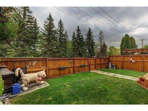 84 Riverside Way Se, Calgary, AB - Outdoor With Backyard