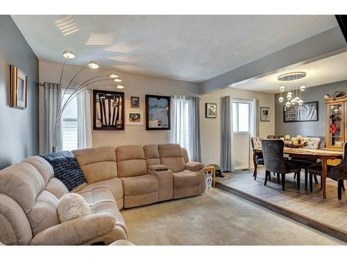 84 Riverside Way Se, Calgary, AB - Indoor Photo Showing Living Room