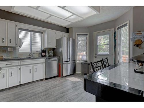 84 Riverside Way Se, Calgary, AB - Indoor Photo Showing Kitchen With Stainless Steel Kitchen