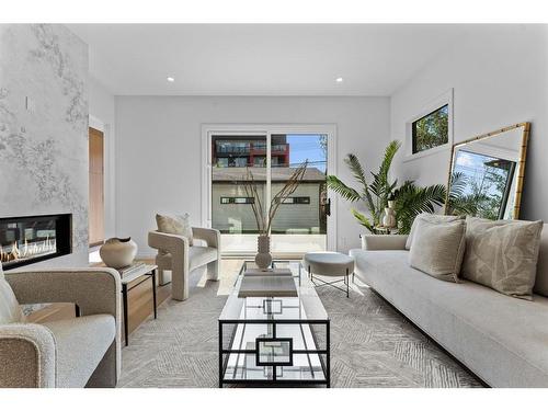 1521 8 Avenue Se, Calgary, AB - Indoor Photo Showing Living Room With Fireplace