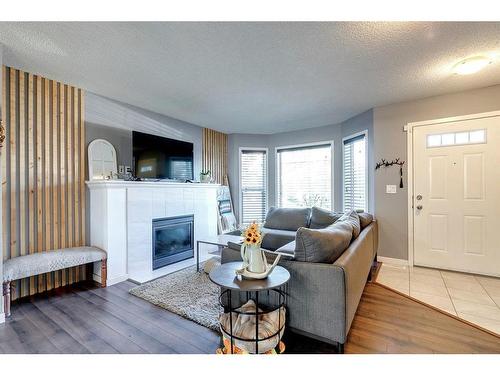 152 Cramond Green Se, Calgary, AB - Indoor Photo Showing Living Room With Fireplace