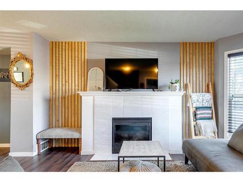 152 Cramond Green Se, Calgary, AB - Indoor Photo Showing Living Room With Fireplace