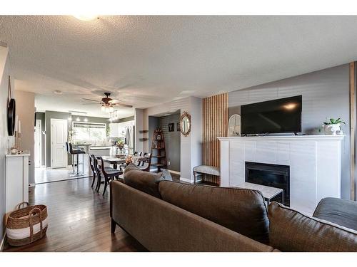 152 Cramond Green Se, Calgary, AB - Indoor Photo Showing Living Room With Fireplace