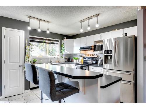 152 Cramond Green Se, Calgary, AB - Indoor Photo Showing Kitchen With Stainless Steel Kitchen