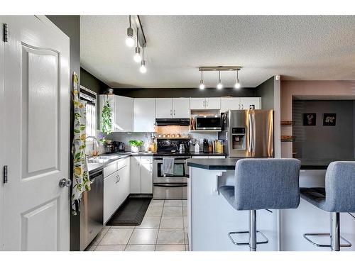 152 Cramond Green Se, Calgary, AB - Indoor Photo Showing Kitchen With Stainless Steel Kitchen