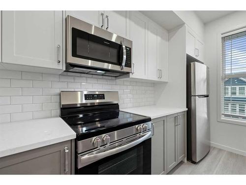 156 Copperleaf Way Se, Calgary, AB - Indoor Photo Showing Kitchen