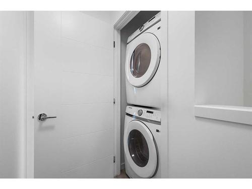 156 Copperleaf Way Se, Calgary, AB - Indoor Photo Showing Laundry Room