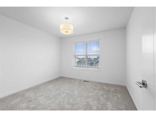 156 Copperleaf Way Se, Calgary, AB - Indoor Photo Showing Other Room