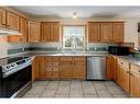 13 Crystal Ridge Cove, Strathmore, AB  - Indoor Photo Showing Kitchen With Double Sink 