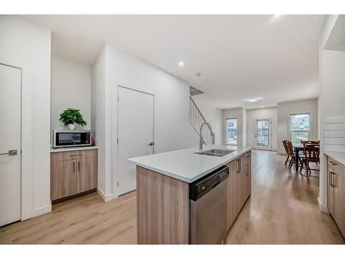 99 Saddlestone Drive Ne, Calgary, AB - Indoor Photo Showing Kitchen With Double Sink