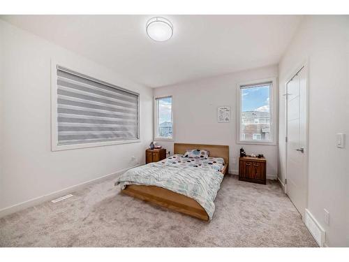 99 Saddlestone Drive Ne, Calgary, AB - Indoor Photo Showing Bedroom