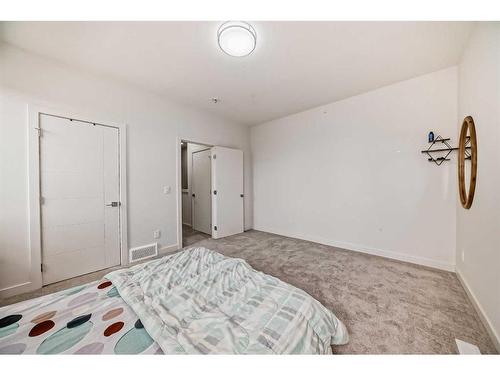 99 Saddlestone Drive Ne, Calgary, AB - Indoor Photo Showing Bedroom