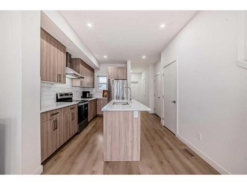 99 Saddlestone Drive Ne, Calgary, AB - Indoor Photo Showing Kitchen With Stainless Steel Kitchen