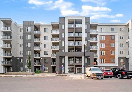 1301-4641 128 Avenue Ne, Calgary, AB - Outdoor With Balcony With Facade