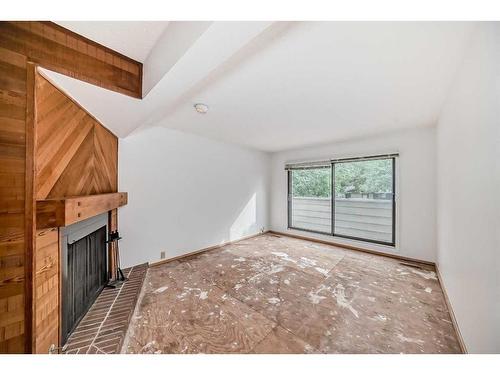 49-3302 50 Street Nw, Calgary, AB - Indoor Photo Showing Other Room With Fireplace