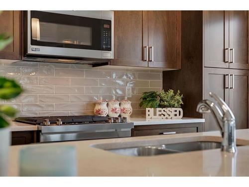 274 Canals Crossing Sw, Airdrie, AB - Indoor Photo Showing Kitchen With Double Sink