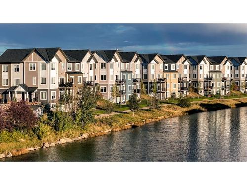 274 Canals Crossing Sw, Airdrie, AB - Outdoor With Body Of Water With Facade