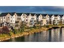 274 Canals Crossing Sw, Airdrie, AB  - Outdoor With Body Of Water With Facade 