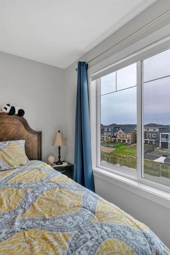 274 Canals Crossing Sw, Airdrie, AB - Indoor Photo Showing Bedroom