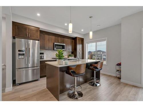 274 Canals Crossing Sw, Airdrie, AB - Indoor Photo Showing Kitchen With Upgraded Kitchen