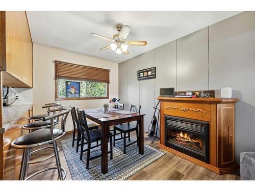 1210 Grey Street, Carstairs, AB - Indoor Photo Showing Other Room With Fireplace