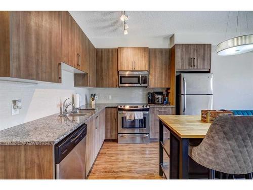 115-16 Sage Hill Terrace Nw, Calgary, AB - Indoor Photo Showing Kitchen With Stainless Steel Kitchen With Double Sink