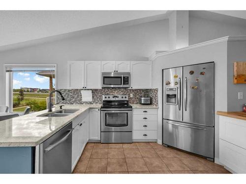 2435 Morris Crescent Se, Airdrie, AB - Indoor Photo Showing Kitchen With Double Sink With Upgraded Kitchen