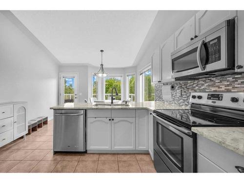 2435 Morris Crescent Se, Airdrie, AB - Indoor Photo Showing Kitchen With Upgraded Kitchen