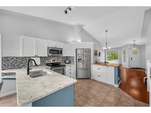 2435 Morris Crescent Se, Airdrie, AB - Indoor Photo Showing Kitchen With Double Sink With Upgraded Kitchen