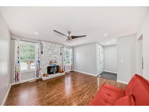 21 Rundlelawn Court Ne, Calgary, AB - Indoor Photo Showing Living Room With Fireplace