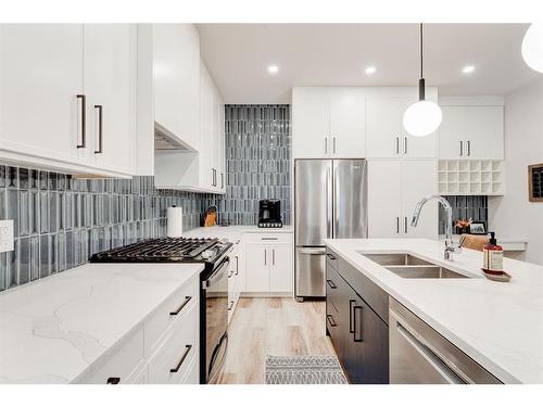 #1-632 56 Ave Sw, Calgary, AB - Indoor Photo Showing Kitchen With Stainless Steel Kitchen With Double Sink With Upgraded Kitchen