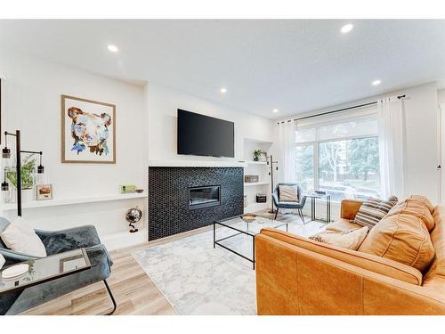 #1-632 56 Ave Sw, Calgary, AB - Indoor Photo Showing Living Room With Fireplace