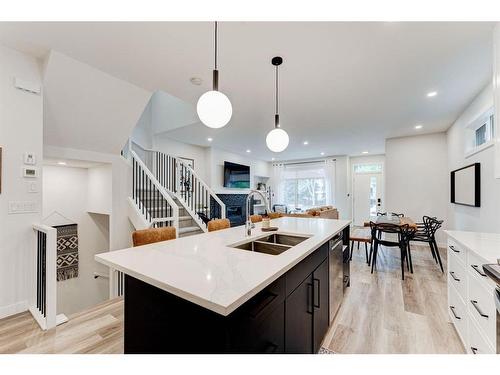 #1-632 56 Ave Sw, Calgary, AB - Indoor Photo Showing Kitchen With Double Sink With Upgraded Kitchen