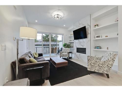 2010 26A Street Sw, Calgary, AB - Indoor Photo Showing Living Room With Fireplace