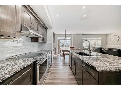 136 Saddlecrest Green Ne, Calgary, AB - Indoor Photo Showing Kitchen With Double Sink With Upgraded Kitchen