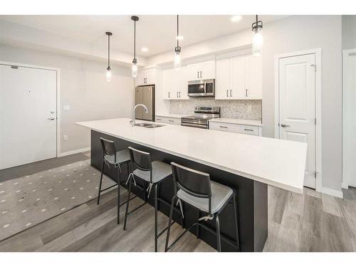 222-360 Harvest Hills Way Ne, Calgary, AB - Indoor Photo Showing Kitchen With Stainless Steel Kitchen With Double Sink With Upgraded Kitchen