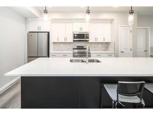 222-360 Harvest Hills Way Ne, Calgary, AB - Indoor Photo Showing Kitchen With Stainless Steel Kitchen With Double Sink With Upgraded Kitchen