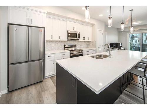 222-360 Harvest Hills Way Ne, Calgary, AB - Indoor Photo Showing Kitchen With Stainless Steel Kitchen With Double Sink With Upgraded Kitchen