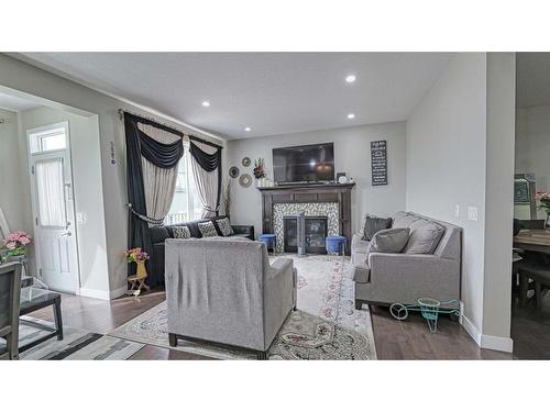 115 Saddlelake Way Ne, Calgary, AB - Indoor Photo Showing Living Room With Fireplace