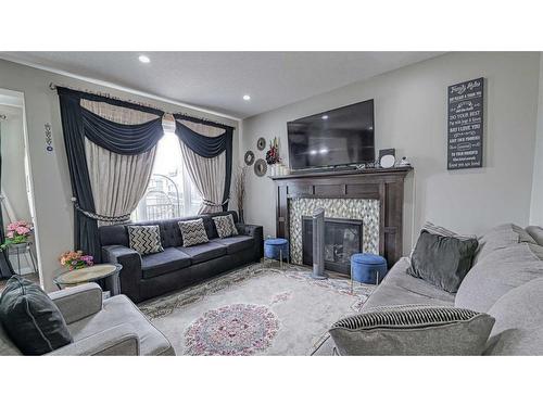 115 Saddlelake Way Ne, Calgary, AB - Indoor Photo Showing Living Room With Fireplace