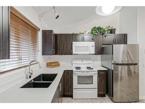 30 Martinwood Road Ne, Calgary, AB - Indoor Photo Showing Kitchen With Double Sink