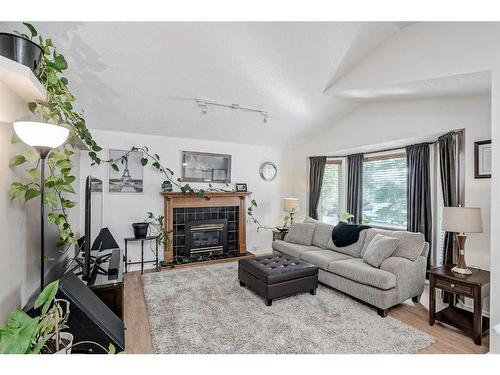 30 Martinwood Road Ne, Calgary, AB - Indoor Photo Showing Living Room With Fireplace