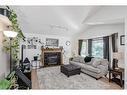 30 Martinwood Road Ne, Calgary, AB  - Indoor Photo Showing Living Room With Fireplace 