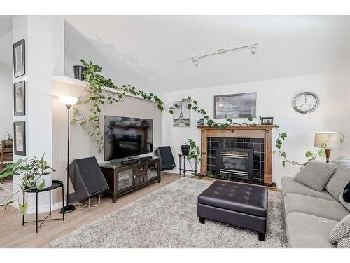 30 Martinwood Road Ne, Calgary, AB - Indoor Photo Showing Living Room With Fireplace