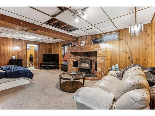 535 Markerville Road Ne, Calgary, AB - Indoor Photo Showing Basement With Fireplace