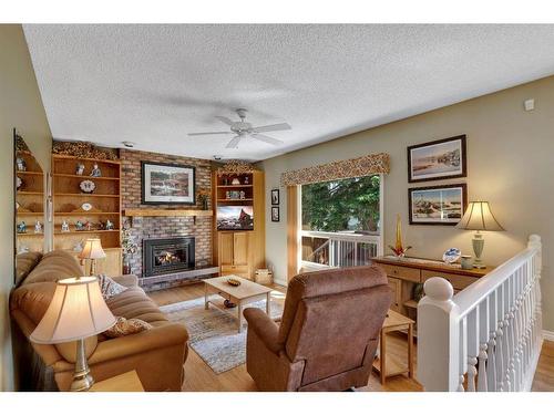 104 Edgedale Drive Nw, Calgary, AB - Indoor Photo Showing Living Room With Fireplace