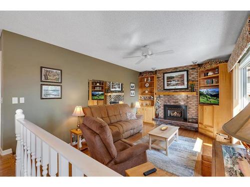 104 Edgedale Drive Nw, Calgary, AB - Indoor Photo Showing Living Room With Fireplace