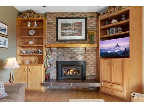 104 Edgedale Drive Nw, Calgary, AB - Indoor Photo Showing Living Room With Fireplace