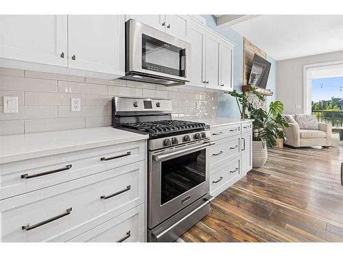 227 Reunion Green Nw, Airdrie, AB - Indoor Photo Showing Kitchen With Upgraded Kitchen